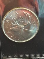 Front side showing caribou and denomination details