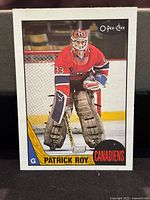 Front of 1987-88 OPC Patrick Roy hockey card showing goalie in Canadiens uniform with branding.