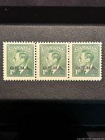 Front view of the strip of three 1 cent Canada stamps featuring King George VI with O.H.M.S. overprint in green and black.