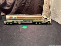 Side profile of the CITGO toy tanker truck showing the full length and detailed CITGO logo and stripes on the tanker trailer.