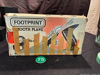 Image of the Footprint No.4B smooth plane box with heavy tape on one side and visible shelf-wear