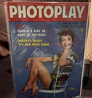 Photoplay magazine front cover dated October 1960 with Debbie Reynolds seated on a chair and headlines about various celebrities.