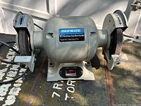 Front view of Shopmate heavy duty 6 inch bench grinder showing wheels, guards and power cord.