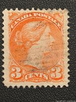 Front of an orange 3 Cent Canada Postage stamp from 1870 featuring the right profile of Queen Victoria, showing postal cancellation marks and perforated edges.