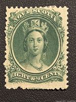 Front image of unused Nova Scotia 8 cent Queen Victoria postage stamp from the 1860s. Features green color and intricate detailing with a portrait of Queen Victoria.