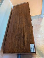 Top view of the dresser showing the wood grain on the top surface.