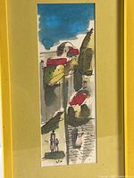 Close-up of painting displaying cityscape with rooftops and figures beneath bright blue sky, mounted on muted yellow mat.