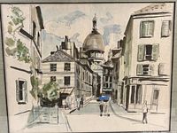 Close-up of the watercolor print details showing buildings, street, pedestrians, and sky, highlighting the print style and colors.