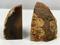Front and side views highlighting polished brown banded agate surfaces and rough natural stone textures on a pair of geode bookends.