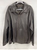 Front view of Jos. A. Bank dark brown leather jacket showing collar, zipper, elastic waistband and sleeves.