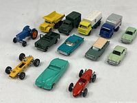 Overview of all 11 die cast cars and trucks including variety of models and colors, some identifiable brands and types.
