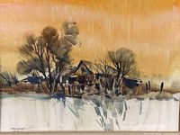 Close-up of watercolor painting depicting a house with trees by a lake in winter or late autumn colors under an ochre sky.