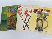 Three original watercolor paintings by Beryl Floris on paper, showing floral themes and beer steins, each 9x12 inches, unframed.