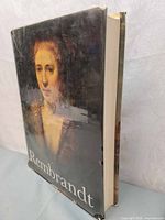Front cover of the book showing a close-up portrait painting by Rembrandt with the title 'Rembrandt'