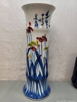 Front view of the vase showing floral pattern and calligraphy