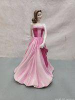 Front view of Royal Doulton Pretty Ladies figurine showing detailed pink strapless gown and facial features.