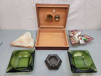 Photo showing all six items including wooden dehumidifier box and various vintage ashtrays