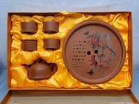 Full view of Yixing clay teapot set with teapot, four teacups, and decorated round tray