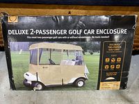 Image of the Fairway Deluxe 2-Passenger Golf Car Enclosure box showing product name and image of the enclosure on a golf cart.