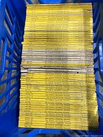 Top view showing stacks of vintage National Geographic magazines from 1930s and 1940s with yellow spines and clear volume and date labeling.
