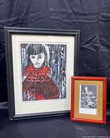 Both framed woodblock prints together showing size comparison and framing
