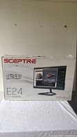 Photo of original Sceptre E24 Ultra Slim LED Monitor box showing model and branding.