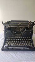 Front view of black Underwood No. 5 manual typewriter with visible keyboard and body.