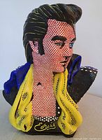 Front angle close up showing Elvis bust with pop art dots and signature yellow scarf and blue collar.