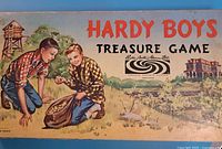 Top view of Hardy Boys Treasure Game box lid with illustration of two boys and game title.