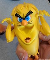 Close-up of monster Tweety Bird figure showing facial features and movable mouth opened via back mechanism.