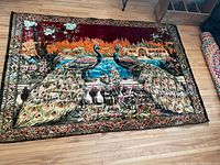 Full view of the large themed tapestry showing two peacocks surrounded by foliage and architectural elements.