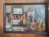 Frontal photo of antique print titled "Men's Tavern Pipe Club" showing the full oak wood frame with the print under glass