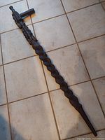 Full view of the barley twist walking stick showing its entire length and design.