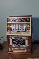 Front view of the vintage Jackpot slot machine themed radio showing the slot reels, colorful buttons, and Jackpot signage