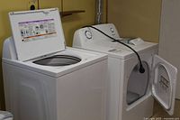 Washer and dryer side by side showing overall condition