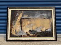 Framed original abstract painting showing full view of the artwork with dominant yellow and gray tones, framed in dark wood frame with light inner border, displayed against a blue background.