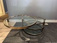 Left top glass tier extended swivel, two lower tiers closed