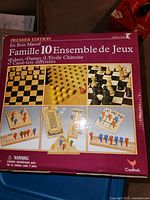 Premier Edition wooden box showing 10 games including chess and tic tac toe