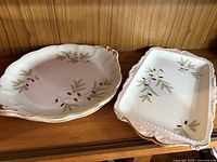 Stack of small plates alongside the rectangular serving tray