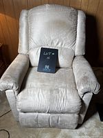 Light beige La-Z-Boy recliner chair showing front upholstery and general wear.