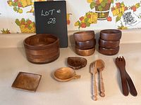 Full view of all items including large bowl, smaller bowls, small plates, and utensils.