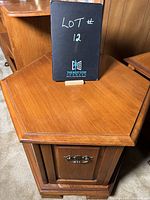 Hexagonal wooden end table with a clean top surface and visible wood grain, showing the overall shape and finish.