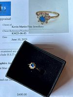 Ring in black jewelry box displayed on Facets appraisal certificate showing ring photo and appraisal header