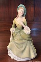 Front view of the Royal Doulton 'Sandra' figurine showing detailed dress and facial features.