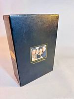 Black box set front with character image labeled The Complete Series, showing slight scuff and corner damage.