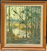 Front view of framed canvas print showing forest river scene