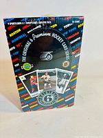 Front view of factory sealed box showing branding and design details