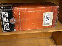 Box with text indicating 9mm-30.06 caliber double blast target for handguns to high spinner, new in package