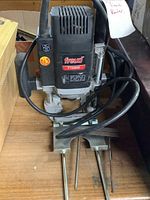 Front view of Freud FT2000E router showing brand label, power cord, and base