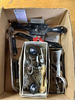 Box containing two spokeshaves, router plane, block plane